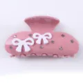 Pinza de pelo de acrílico rosa con lazos blancos y pedrería brillante para un estilo elegante. - Lazo Beige