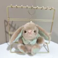 Schattige bruine pluche konijn sleutelhanger met mintgroene cape en parel decoratie tas. - Lichtbruin