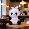 Detail shot of cute panda plush toy wearing pink floral bonnet sitting in a cafe. - Summer Headband - Pink Floral / 22cm