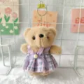 Close-up of cute plush bear keychain wearing a purple plaid dress, soft texture detail. - 15cm Ordinary Flat Ring / Brown Bear in Purple Skirt
