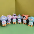 Cute plush penguin pendant detail showcasing colorful hooded dolls with clear fish accessories. - Mixed Colors