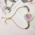 Heart-shaped purple dial rhinestone ladies watch detail, elegant adjustable pull chain. - Purple