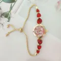 Fashion women quartz watch with red heart crystal stones and gold tone slider chain strap. - Gold Case Red