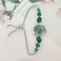 Fashion women quartz watch with green heart gems and adjustable silver sliding bracelet. - Silver Case Green Dial