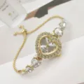 Herzförmige Strass-Quarzuhr Detail, elegantes goldenes Zugarmband Design für Damen und Mädchen. - Gold Weiß