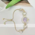 Elegante reloj de pulsera con pedrería para mujer con esfera ovalada violeta y cadena dorada. - Púrpura