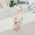 Elegant rose gold women quartz watch with floral bracelet strap and clear white dial design. - White