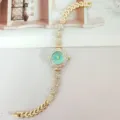 Gold rhinestone quartz women watch with floral dial and crystal bracelet band luxury style. - Gold and Green