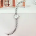 Silver rhinestone floral quartz wristwatch for women, sparkly crystal link bracelet watch. - Silver White