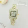 Elegant women's square quartz watch featuring sparkling rhinestones on gold tone metal band. - Gold