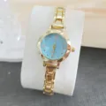 Montre quartz femme de luxe minimaliste avec cadran bleu et bracelet doré élégant. - Or & Bleu Clair