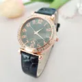 Women's quartz watch with crystal bezel, dark dial and black leather strap for daily wear. - Black