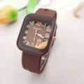 Brown square silicone quartz watch with clear numbers and swan detail for women. - Brown
