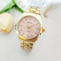 Detail view of a luxury gold quartz watch with pink diamond dial and steel strap. - Men / Gold Pink