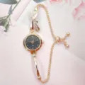 Elegant women quartz watch with bow rhinestone design, fashionable gold chain bracelet timepiece. - Black