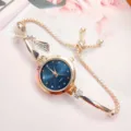 Elegant rose gold quartz watch detail showing rhinestone bow accent and blue dial. - Blue