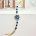 Goldfarbene Damen Quarzarmbanduhr mit blauen Tropfensteinen und Strass Armband Uhr - Gold Blau