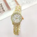 Detailed view of a luxury gold rhinestone quartz women watch with sparkling diamond bezel. - Gold White