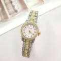 Close-up detail of women quartz watch with sparkling rhinestones, pink dial and metallic steel band. - Two Tone Gold Pink
