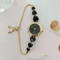 Elegante Damen Quarzuhr mit Goldkette und schwarzen Herz-Kristallen verstellbarem Armband - Gold Schwarz