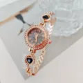 Elegante orologio da donna al quarzo oro rosa con lunetta in strass e dettagli cuori neri. - Oro Rosa Nero