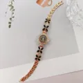 Damen Quarzuhr mit Strass Blumen Gliedern elegante goldene Armbanduhr fuer den Alltag - Roségold Schwarz