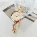 Elegant women gold quartz watch with sparkling crystal bracelet, luxury numerical dial detail. - White