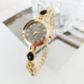 Women quartz bracelet watch gold tone black dial elegant fashion casual wristwatch details. - Black
