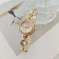 Orologio da donna al quarzo dorato in dettaglio, elegante bracciale a catena con cuore chic. - Oro Bianco