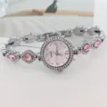 Elegante Damen Quarzuhr mit rosafarbenem Zifferblatt und funkelnden Kristall-Armbandgliedern. - Silberrosa