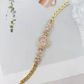 Elegante goldene Damen Quarz Armbanduhr mit rosa Strass Blumen und rosafarbenem Zifferblatt. - Gold Rosa