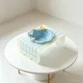 Elevated ceramic pet bowl with cute flower decor and blue striped acrylic stand for cats. - Blue