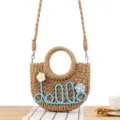 Handmade straw woven crossbody bag with cute blue flower and letter design for daily wear. - Camel + Blue Letters