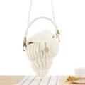 White handmade woven shell crossbody bag with pearl chain and metal hardware for summer beach. - White