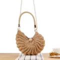 Beige handmade crochet shoulder bag with elegant pearl chain strap and unique shell shape design. - Camel