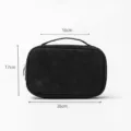 Black leather jewelry travel storage bag with handle and zipper, portable cosmetic organizer. - Black