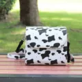 Lederen koeienprint cameratas met schouderriem beschermhoes outdoor fotografie detail - Koeienprint
