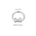 Close-up detail view of titanium segment ring featuring a lovely bow charm and smooth polish finish. - Bowknot Piercing Ring (TIE24180) / 8mm / Silver