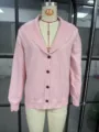 Detailed view of the pink knitted cardigan, highlighting the elegant shawl collar and button closure. - Pink (Style 1)