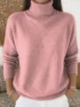 Closeup view of pink knit turtleneck sweater with soft ribbed collar for daily casual winter wear. - Pink