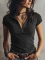 Close-up of women's knit short-sleeve top with front zipper detail and layered necklaces. - S / Black
