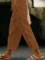 Detailopname van casual broek met knopen aan de zijkant en trekkoord voor dagelijks gebruik. - S / Bottoms / Brons