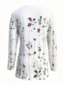 Back view detail of white long sleeve top featuring colorful vertical wildflower print. - S / Photo 2