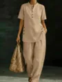 Detailed view of the casual linen two-piece outfit featuring a mandarin collar and buttons. - S / Khaki