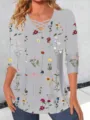 Detail view of the long sleeve floral print t-shirt featuring a chic crisscross V-neck. - S / Gray