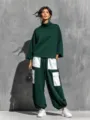 Detailed view of the women casual turtleneck sweatshirt and contrast pocket cargo pants set. - S / Top And Bottom / Dark Green