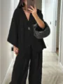 Detailed view of casual black loose V-neck top and wide-leg trousers set, chic. - S / Top And Bottom / Black