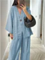 Casual light blue two-piece linen blend outfit featuring a loose V-neck top and wide-leg trousers. - Light Blue
