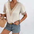 Detail view of stylish women short sleeve v-neck blouse featuring elegant lace trim design. - Khaki