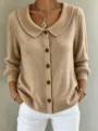 Close-up detail of women's solid color knit cardigan featuring a stylish lapel collar and buttons. - S / Tops / Khaki